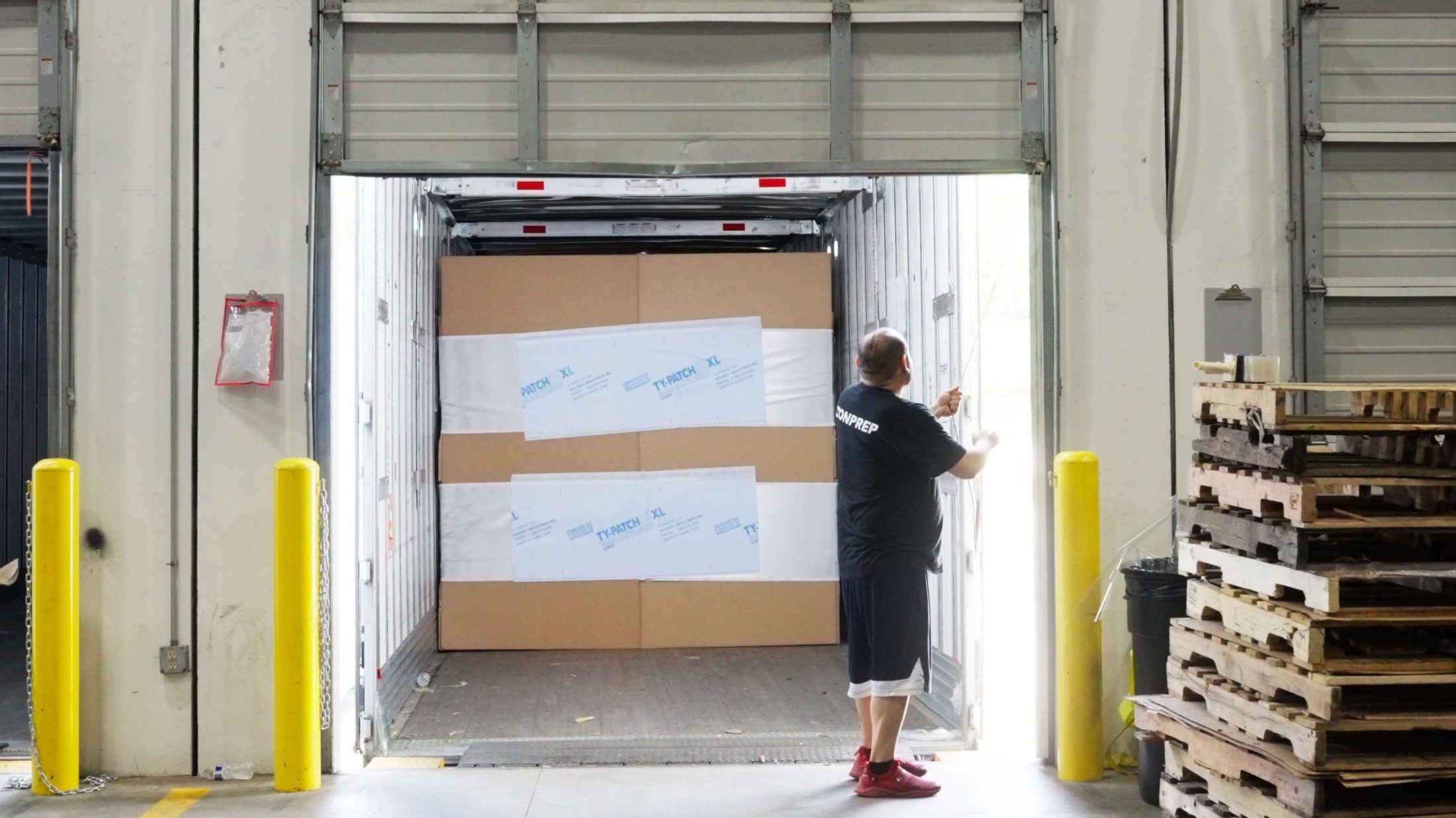 ZonPrep team member at an open dock door receiving inbound freight