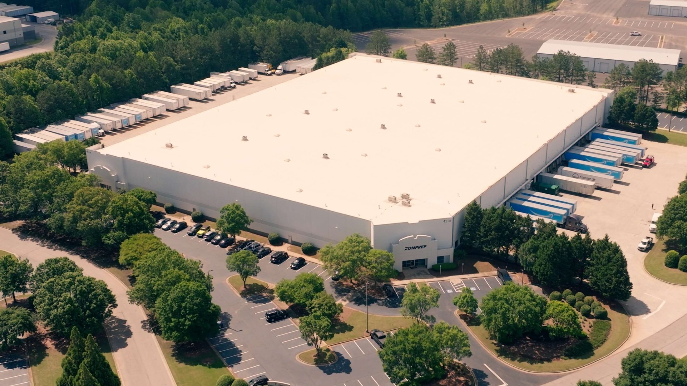 Aerial view of the ZonPrep facility in McDonough, Georgia, showing the building, signage, and trailer yard