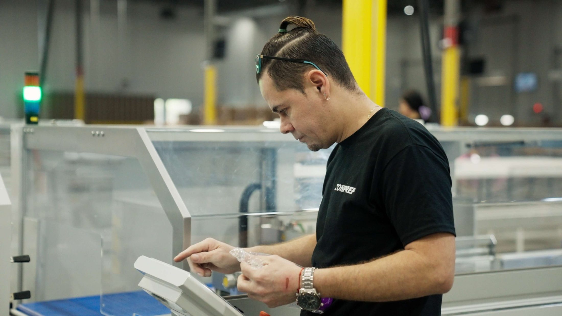 ZonPrep team member polybagging a unit at a dedicated prep station