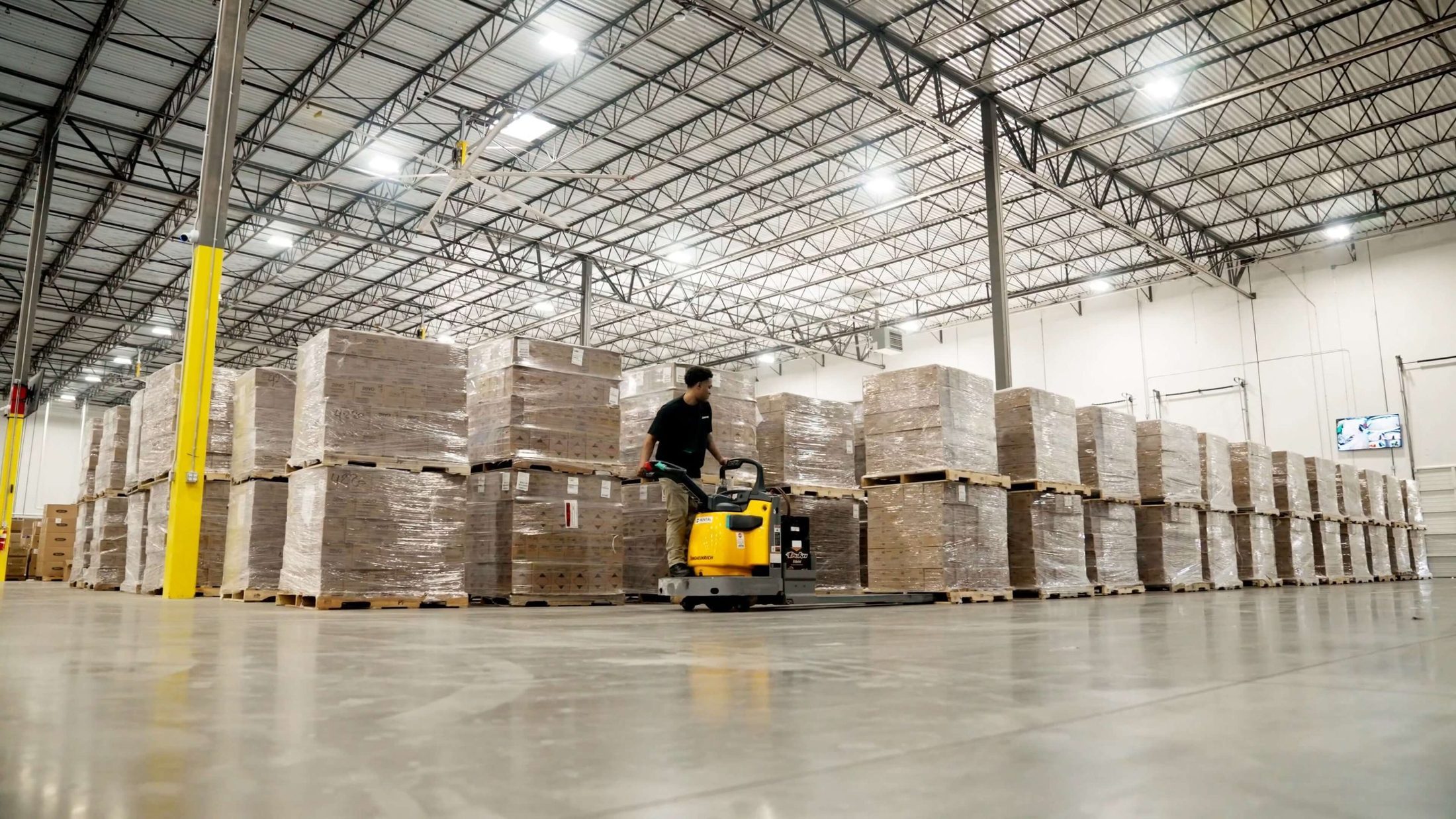 Wide view of the ZonPrep warehouse floor with pallets staged in rows