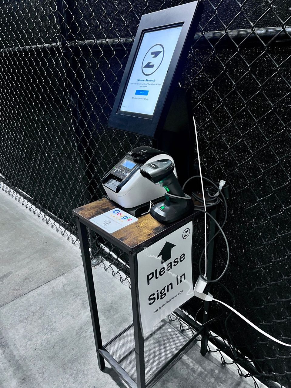 Digital visitor sign-in kiosk with a label printer and barcode scanner